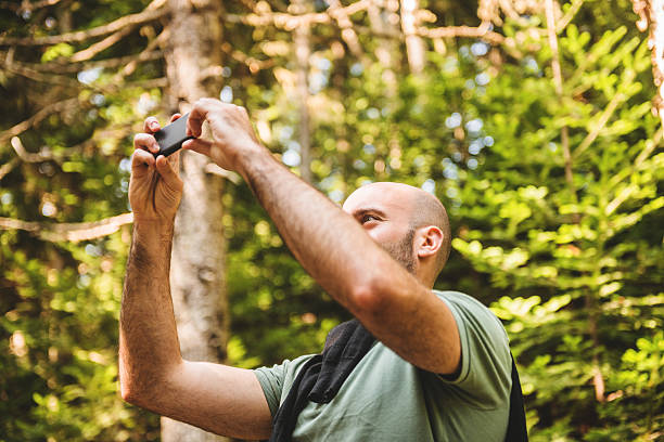 istock man take a selfie on the woods 523476191