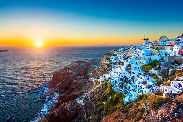 Santorini Oia village, Greece Traditional Greek village Oia (Ia) on Santorini island in dusk, Cyclades, Greece. santorin stock pictures, royalty-free photos & images