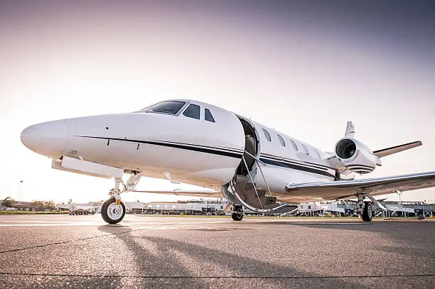 Luxury business jet with open door ready for passenger boarding