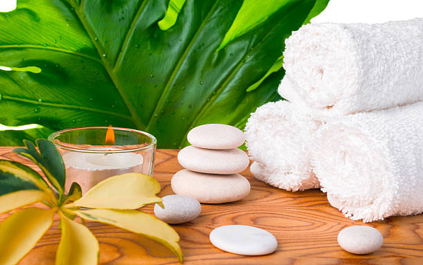 istock beautiful spa still life with white stones, candle, towels, 523476352