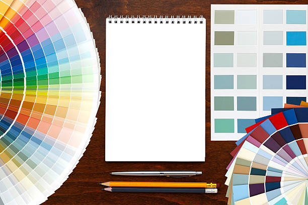 istock Color palette guide on the wooden background and notepad. 523476704