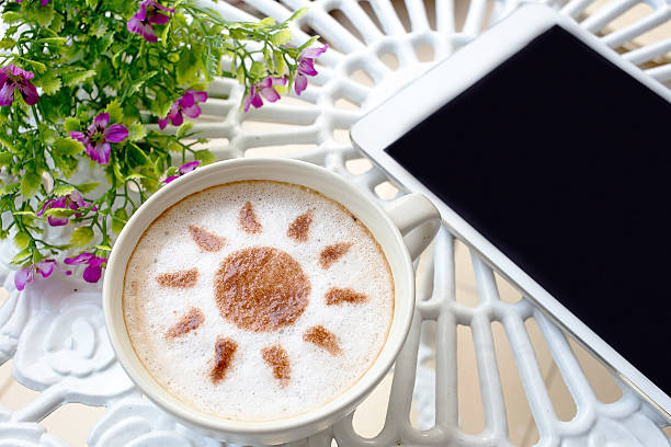 istock latte art coffee and mobile on white table 523476764