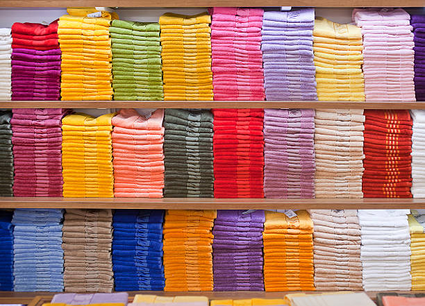 istock Stacks of colored terry towels on the shelves 523477204