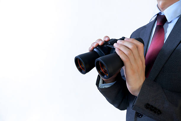 istock Close-up of Businessman looking for something with binoculars 523478314