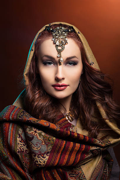 istock Beautiful young woman in shawl 523478584