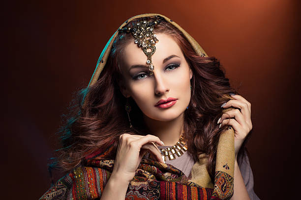 istock Beautiful young woman in shawl 523479048
