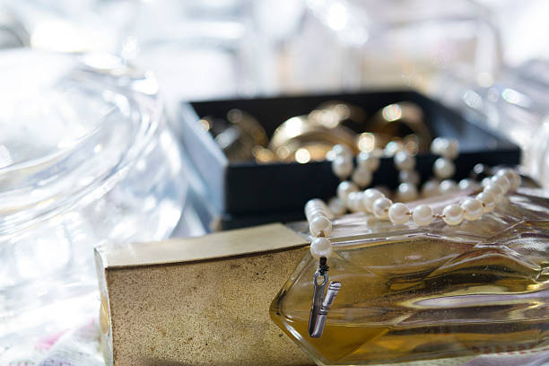 istock pearl necklace on a perfume bottle 523479092