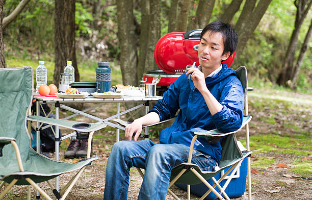 istock Man smoking an electronic cigarette outdoors 523480012