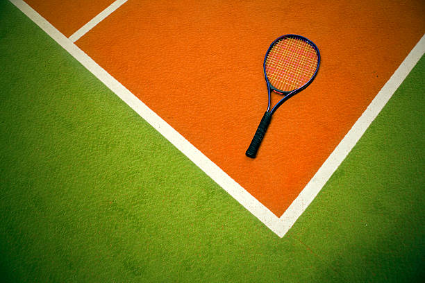 istock corner of playing field and tennis racket 523480596