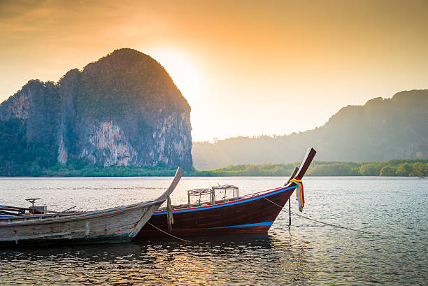 Beach and tropical sea with long-tail boat in thailand