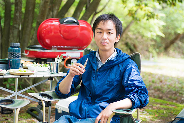 istock Man smoking an electronic cigarette outdoors 523481810