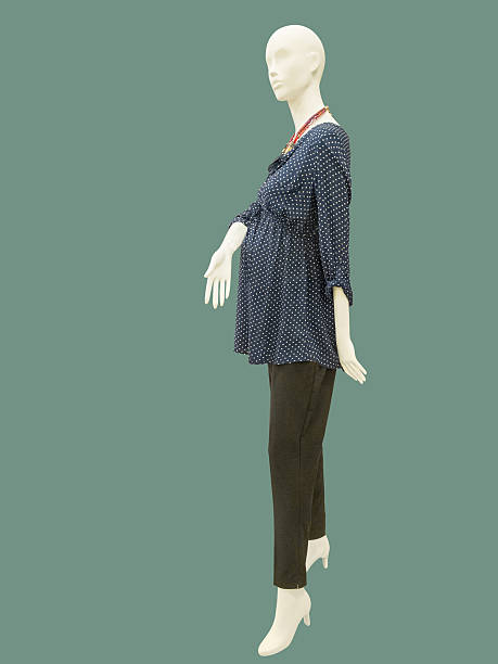 istock Female mannequin dressed in clothes for pregnant wom 523486426
