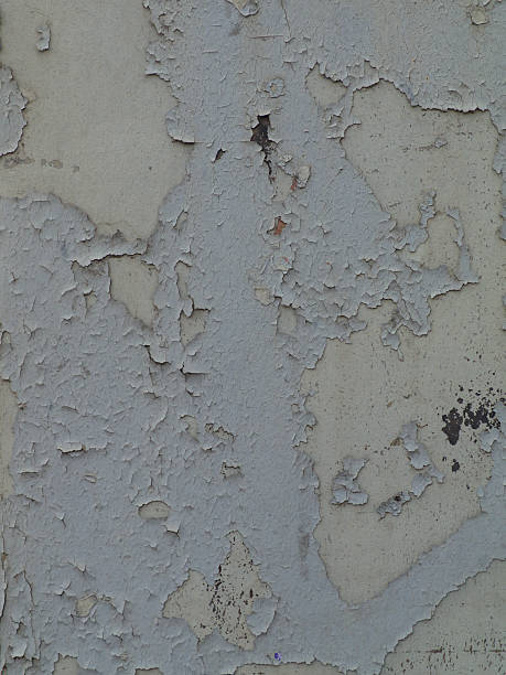 istock Gray cracked paint on an old wall 523488742