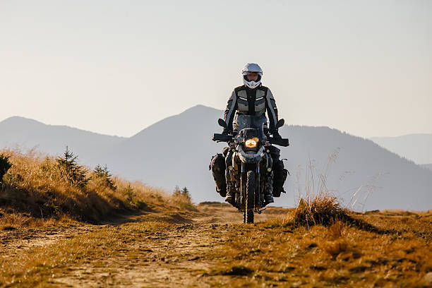 istock Motorbiker travelling in autumn mountains 523488970
