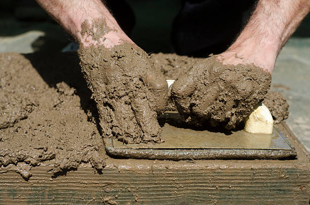 istock Handicrafts. Preparation of mud bricks in the plate 523489002
