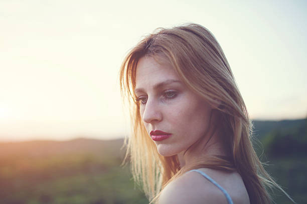 istock Worried girl in sunset 523490160