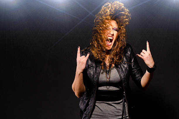 ecstatic woman is dancing to the rock music