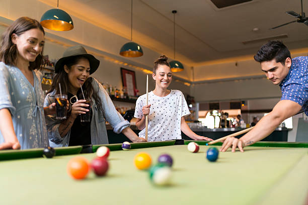 istock Friends Enjoying Pool Game in a Bar 523490996