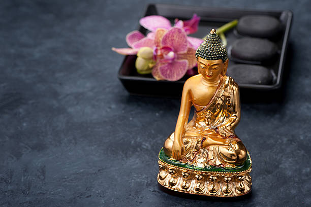 istock Spa. Stones Zen, Buddha statue and orchid flowers 523491614