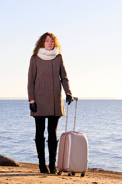 istock Woman with suitcase 523491770