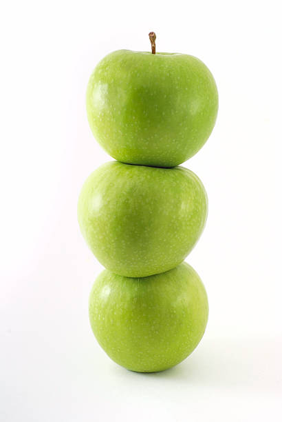 istock Fresh green apples stacked on top of one another 523492462