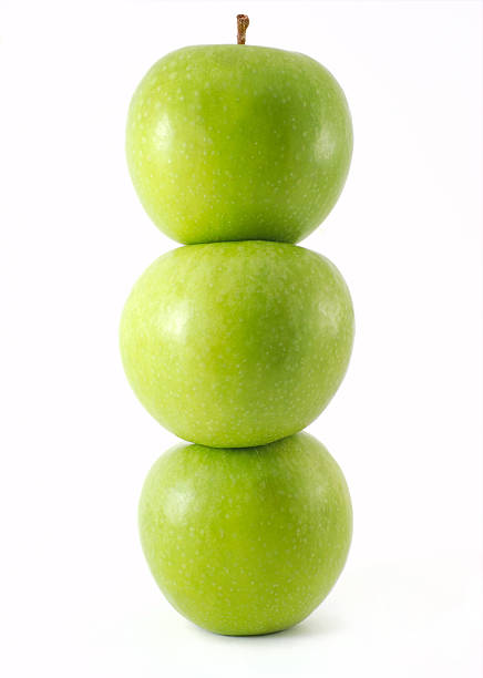 istock Fresh green apples stacked on top of one another 523492496