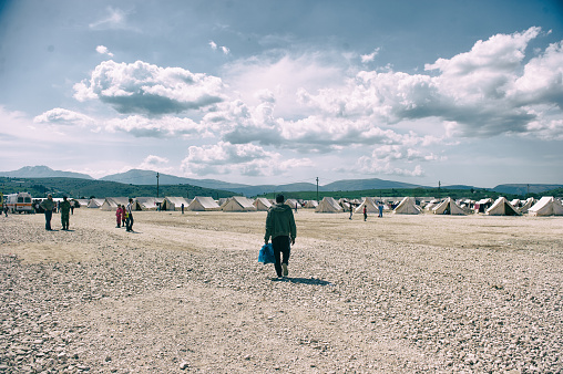 Katsikas, Greece- April 4, 2016. A man walks into Katsikas refugee camp.