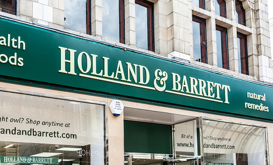 Bournemouth, UK - April 23, 2016: The main sign on the front of a Holland & Barrett shop in Bournemouth town centre, taken from the street. The shop sells health foods and natural remedies.  They have more than 1000 stores in the UK.