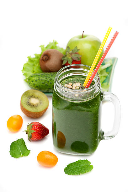 istock Green detox smoothies and ingredients on a white background 523495124
