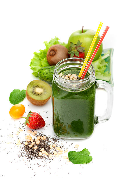 istock Green smoothies and ingredients on a white background 523495158
