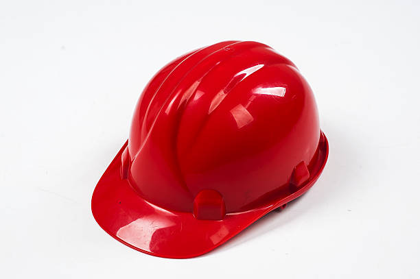 istock Red construction helmet shot isolated on white 523495236
