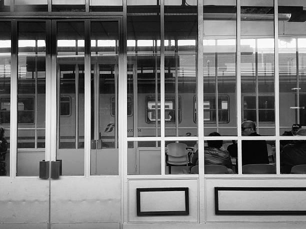 Verona, Italy - april 24, 2016: rail road station of Verona view from a Train. People wanting for train