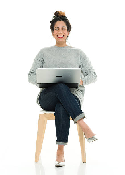 istock Cheerful woman working on laptop 523497030