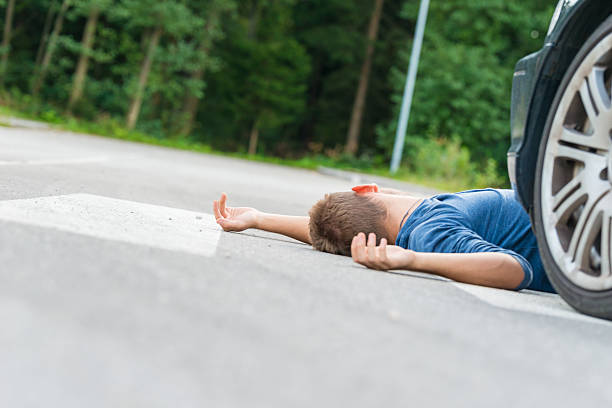 istock Traffic accident.Young man hit by a car 523497112