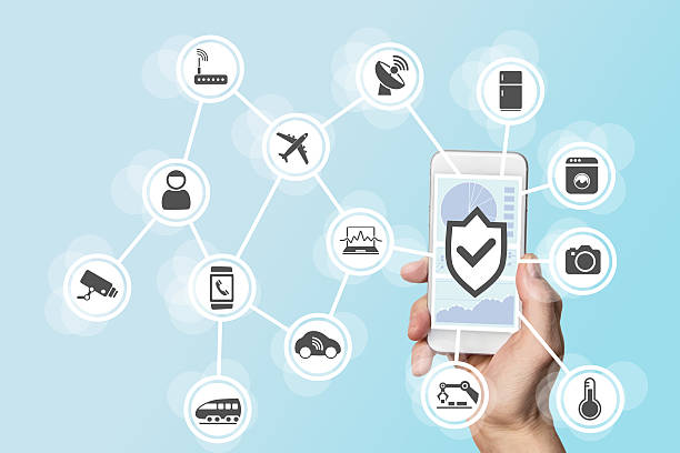 istock Internet of things security concept with hand holding smart phone 523497744