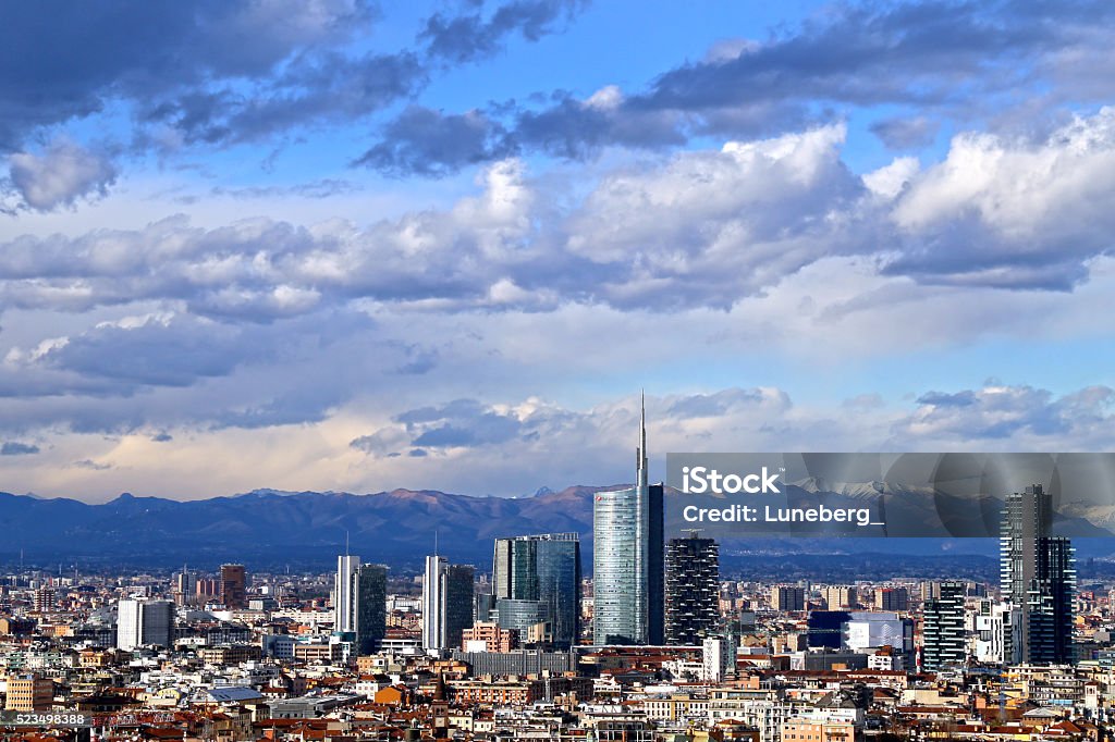 Milano the new skyline The wonderful panorama of the Milan skyline with a blue sky and low clouds, the bright light of a clear day allows you to see the mountains of the Alps Group Milan Stock Photo