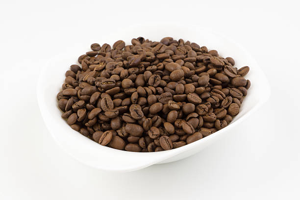 istock white plate full of coffee beans 523498494