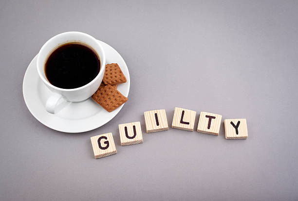 istock Text: Guilty from wooden letters on a gray background. 523500132