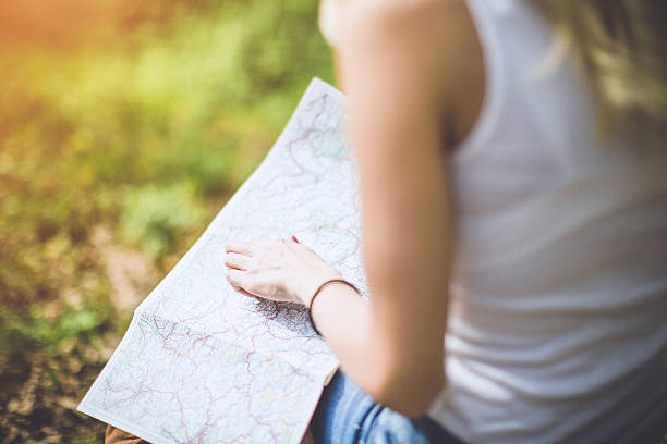istock female hand on the map 523500690
