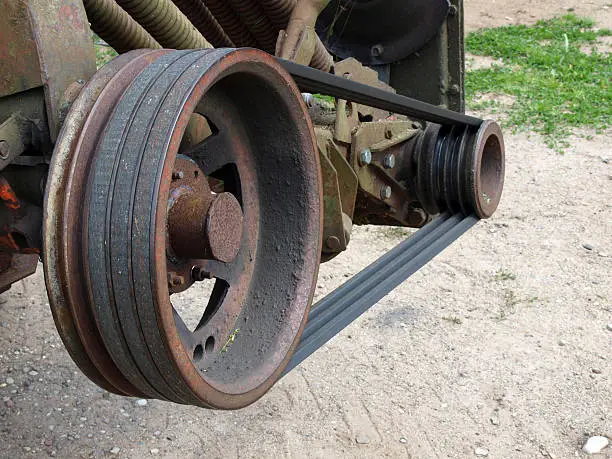 Grass mower transmission from wedge belts and pulleys