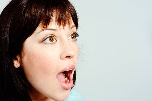 istock Open-mouthed young brunette beauty is amazed 523513765