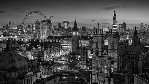 London Skyline B&W London, England, UK, February 22 2014,  A roof top view of London's iconic skyline during the early morning. clock tower photos stock pictures, royalty-free photos & images