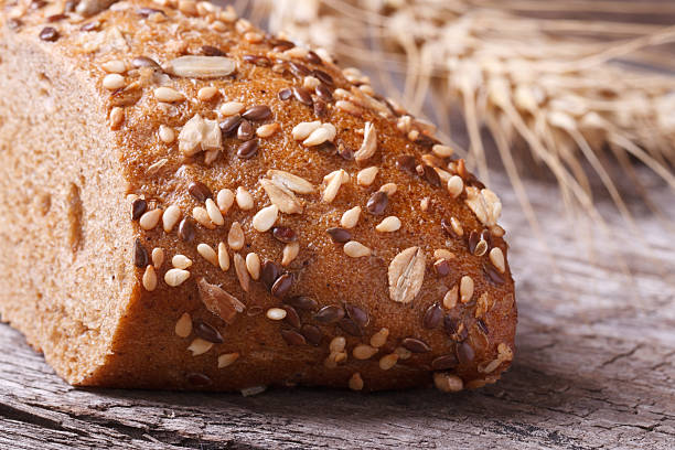 istock bread with seeds and nuts closeup on wooden table 523514201
