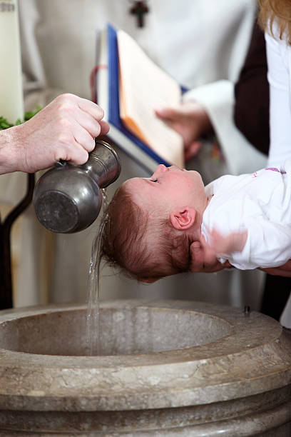 Bautizo Foto de stock y más banco de imágenes de Bautizo - Bautizo, Pila bautismal, Niño - iStock Bautizo Foto de stock y más banco de imágenes de Bautizo - Bautizo, Pila bautismal, Niño - iStock