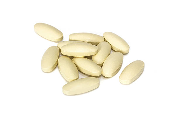 istock Supplement tablets isolated on white backgrounnd 523516387