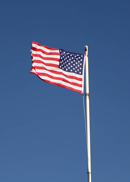 istock U.S. Flag Flying In Stiff Wind 523517171
