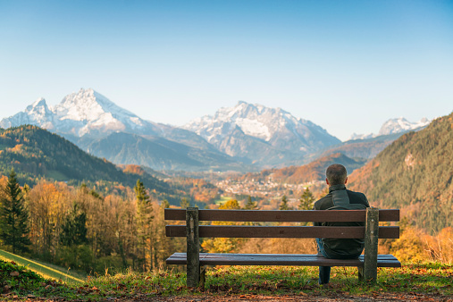 Benches and chairs at tables invite you to relax and unwinwd