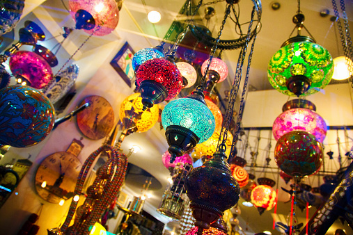 Colorful Glass Turkish Lanterns shot through window.