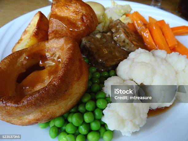 Sunday Roast Dinner Beef Yorkshire Pudding Gravy Roast Potatoes Vegetables Cauliflower Stock Photo - Download Image Now