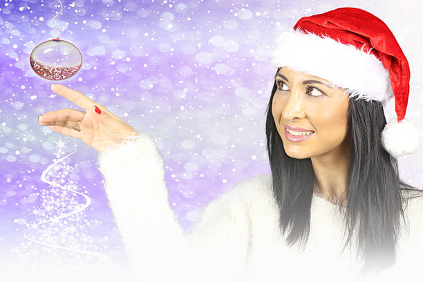 istock beautiful woman with christmas ball 523538583
